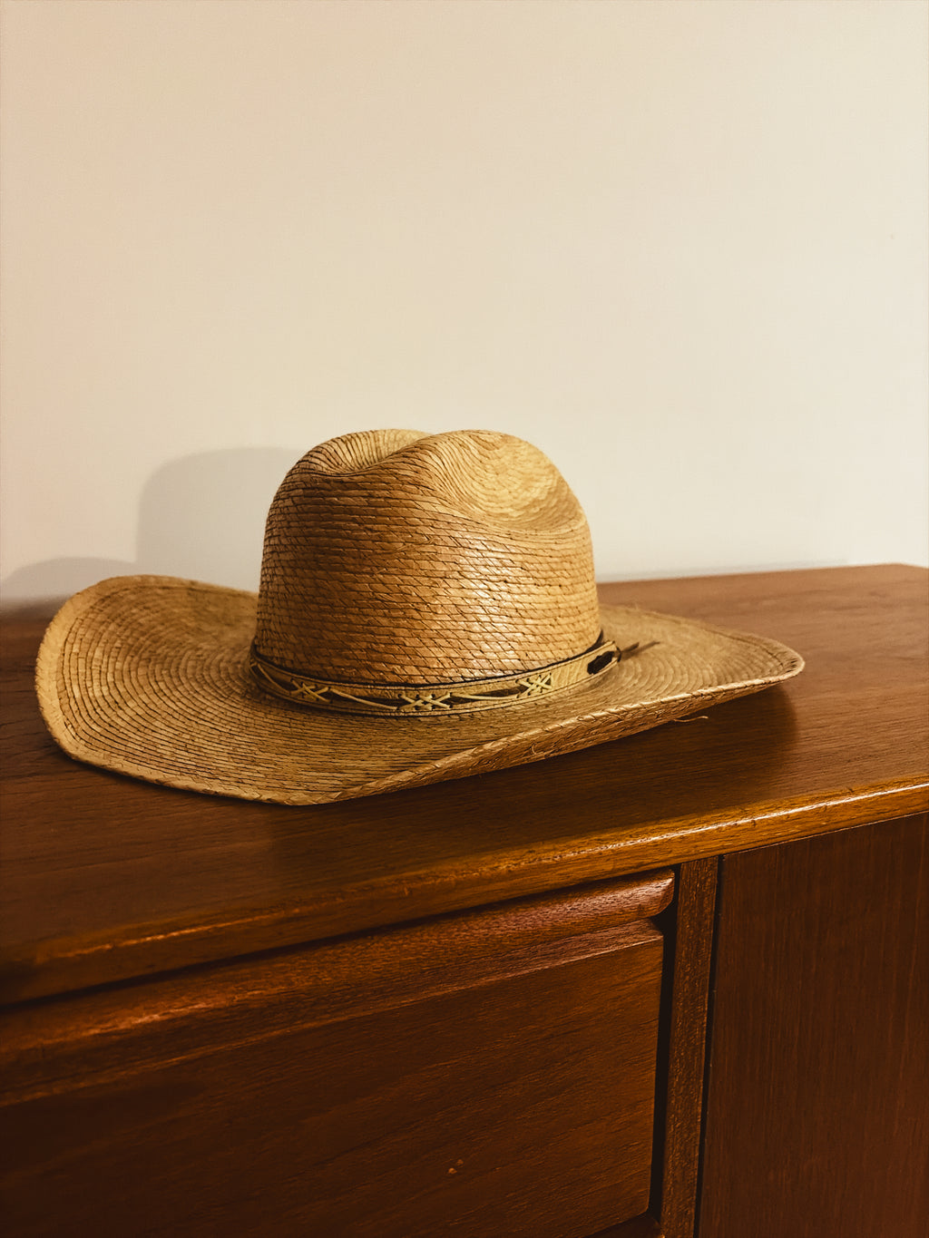 Outback hat and weaved wall mount.