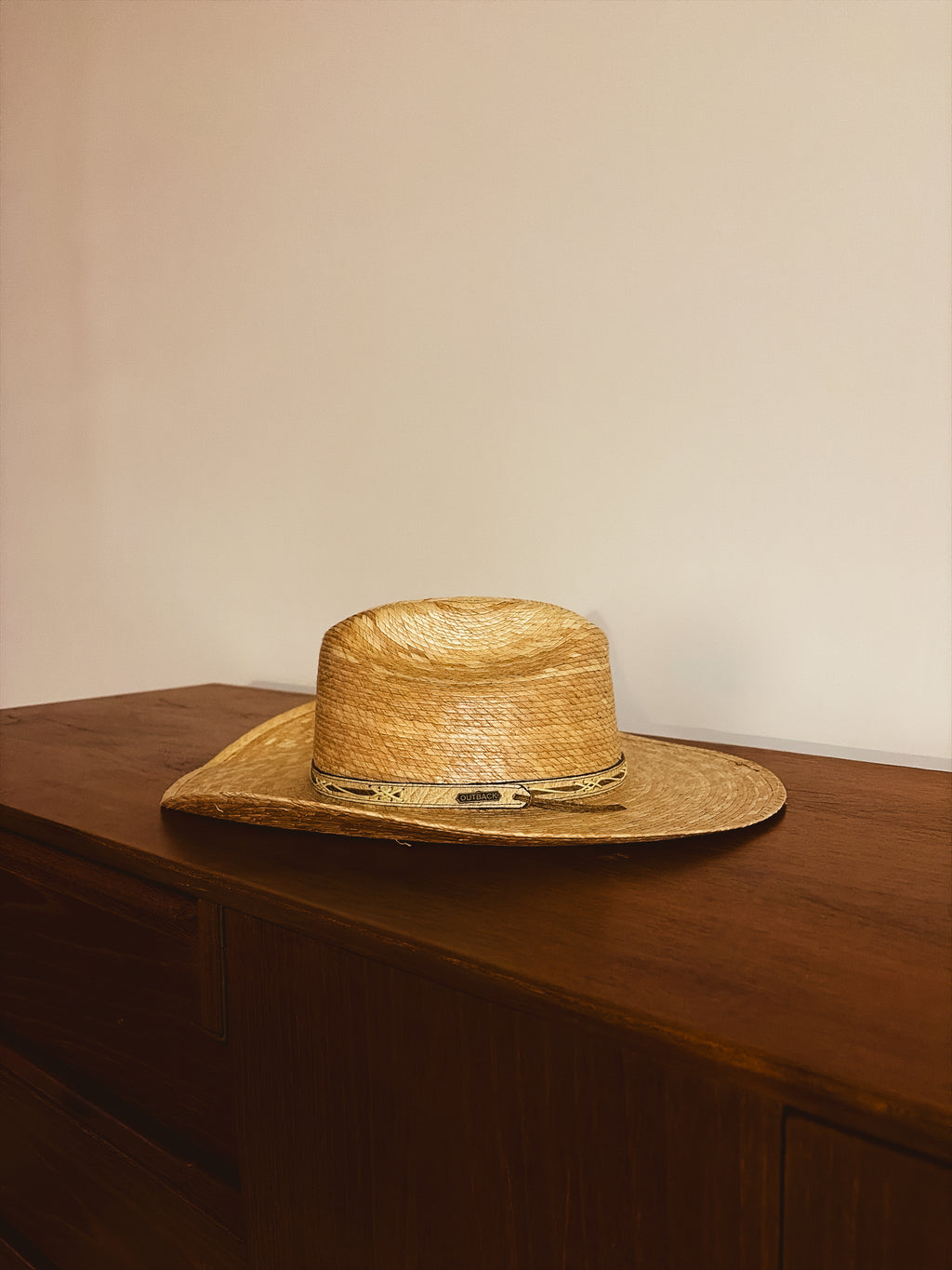 Outback hat and weaved wall mount.