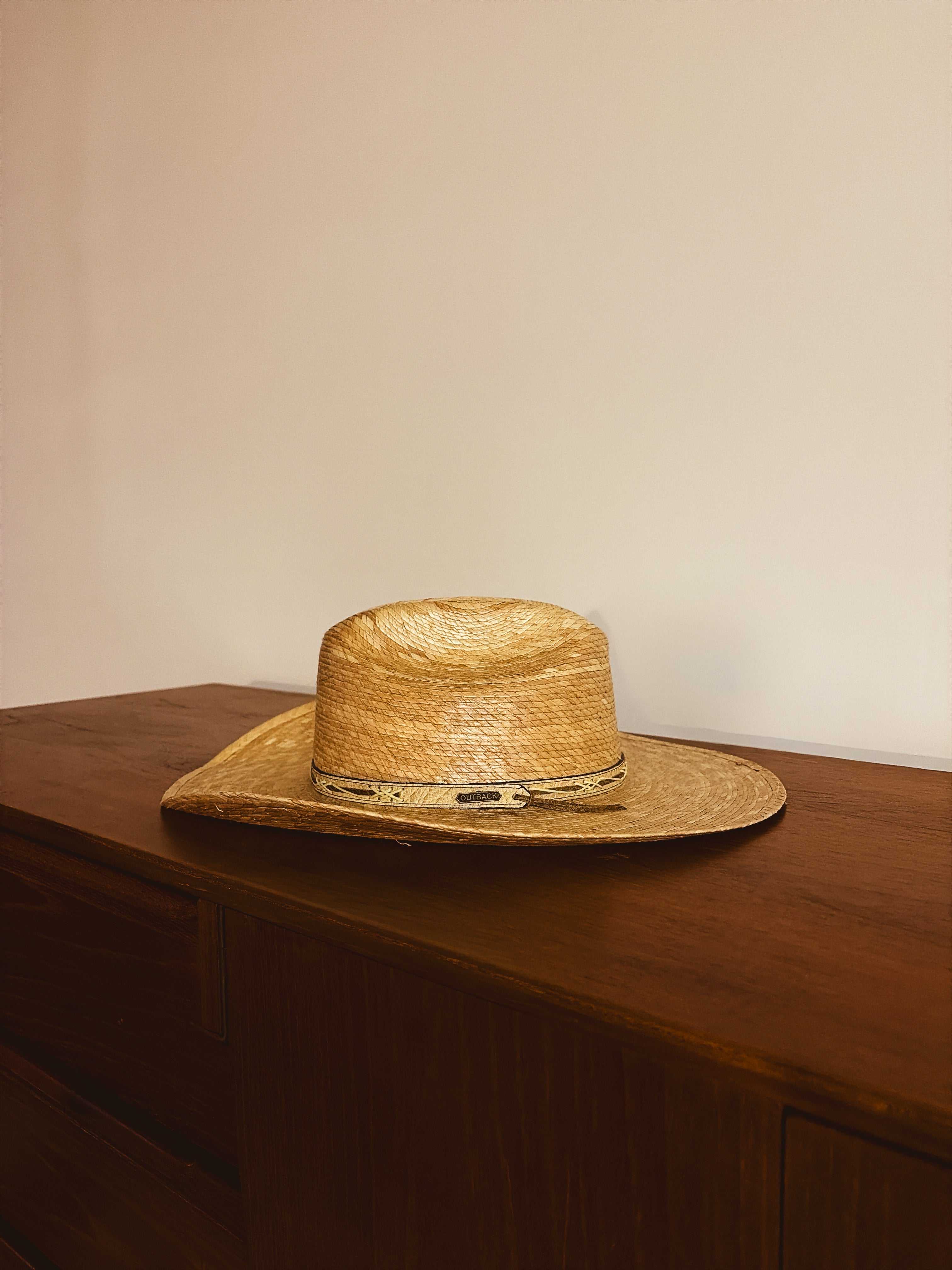Outback hat and weaved wall mount.