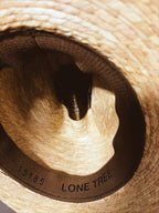Outback hat and weaved wall mount.