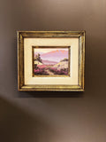 Desert landscape oil painting by E. Hurst — framed, hung on wall