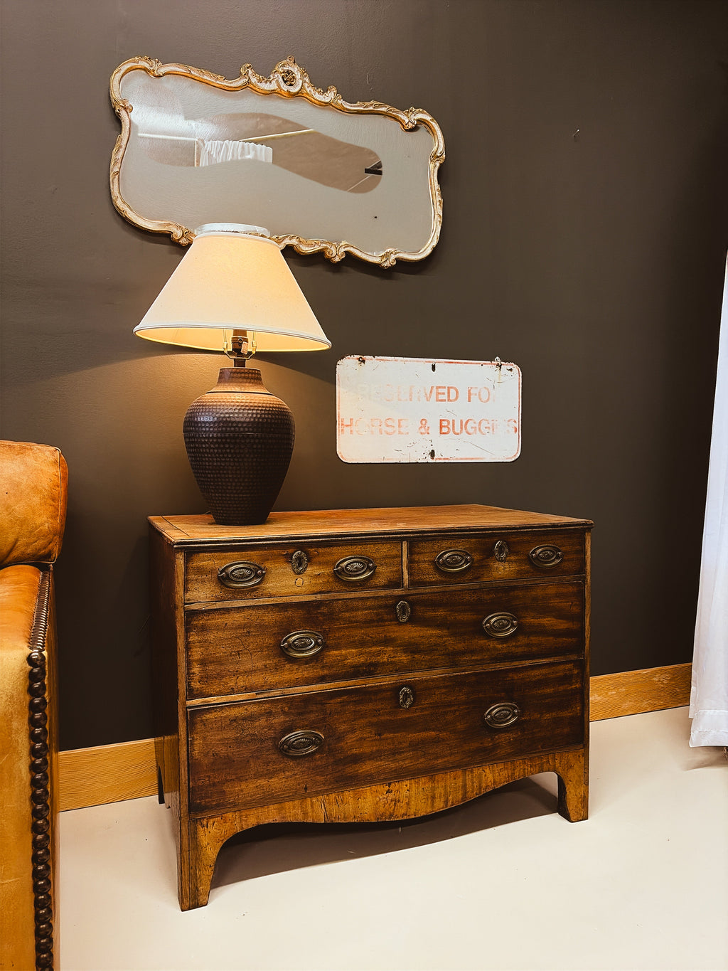 Georgian walnut chest of drawers — full front view showing bow front and brass pulls