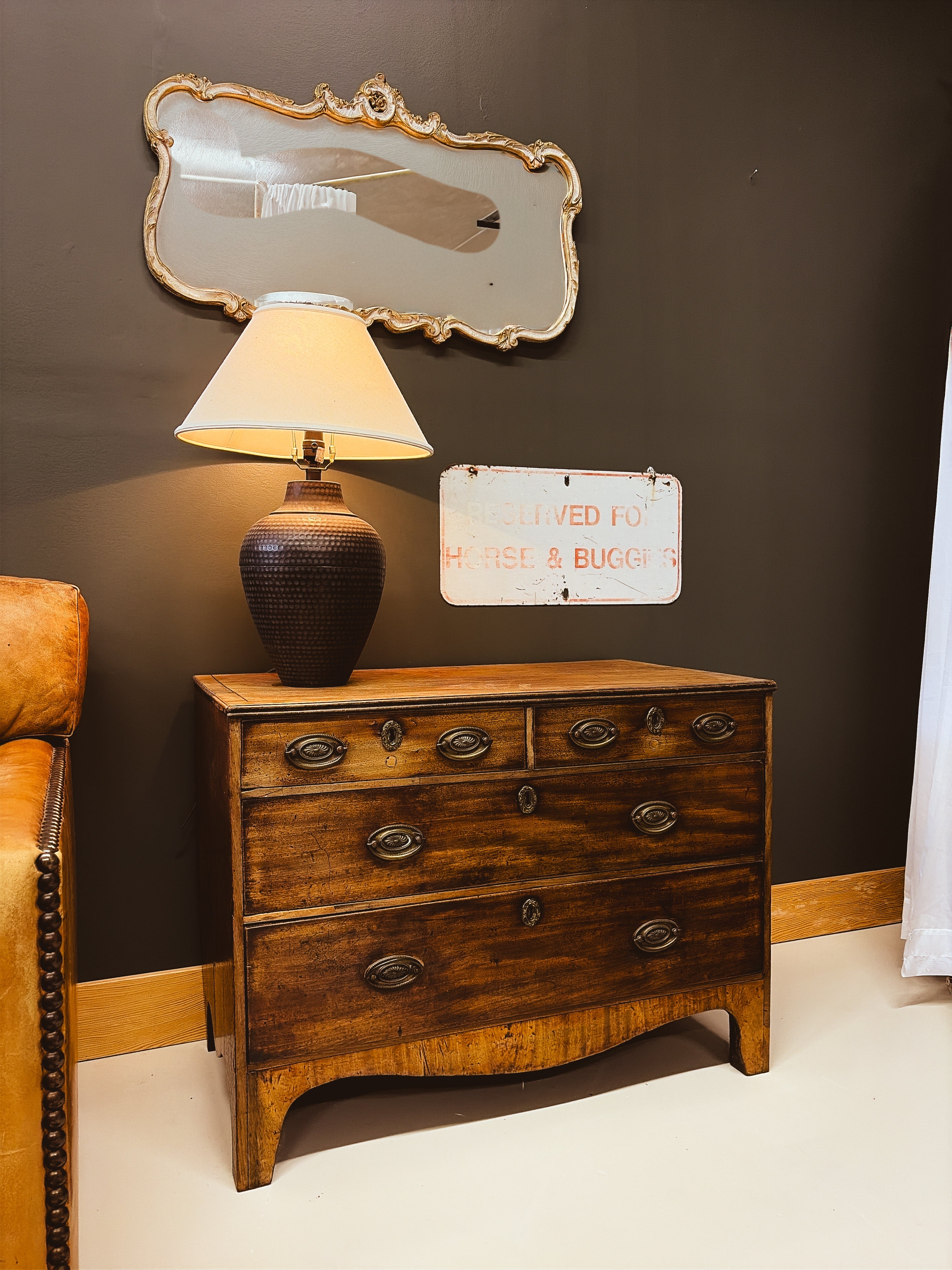 Georgian walnut chest of drawers — full front view showing bow front and brass pulls
