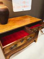 Walnut chest of drawers — drawers open showing red velvet lining