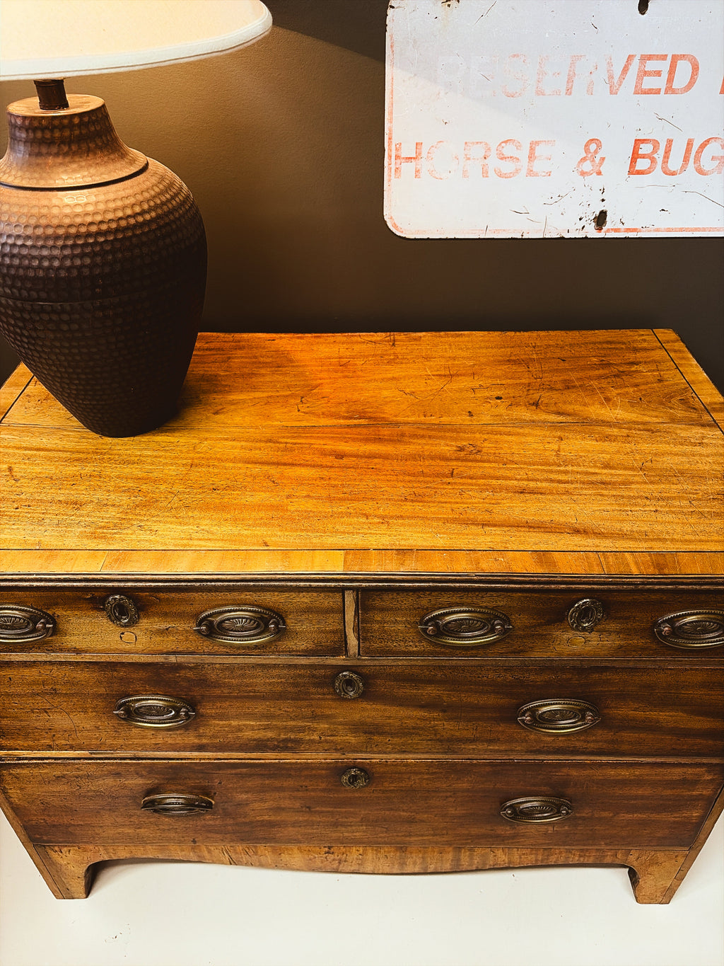 Walnut chest of drawers — top surface detail showing crossbanding and warm patina