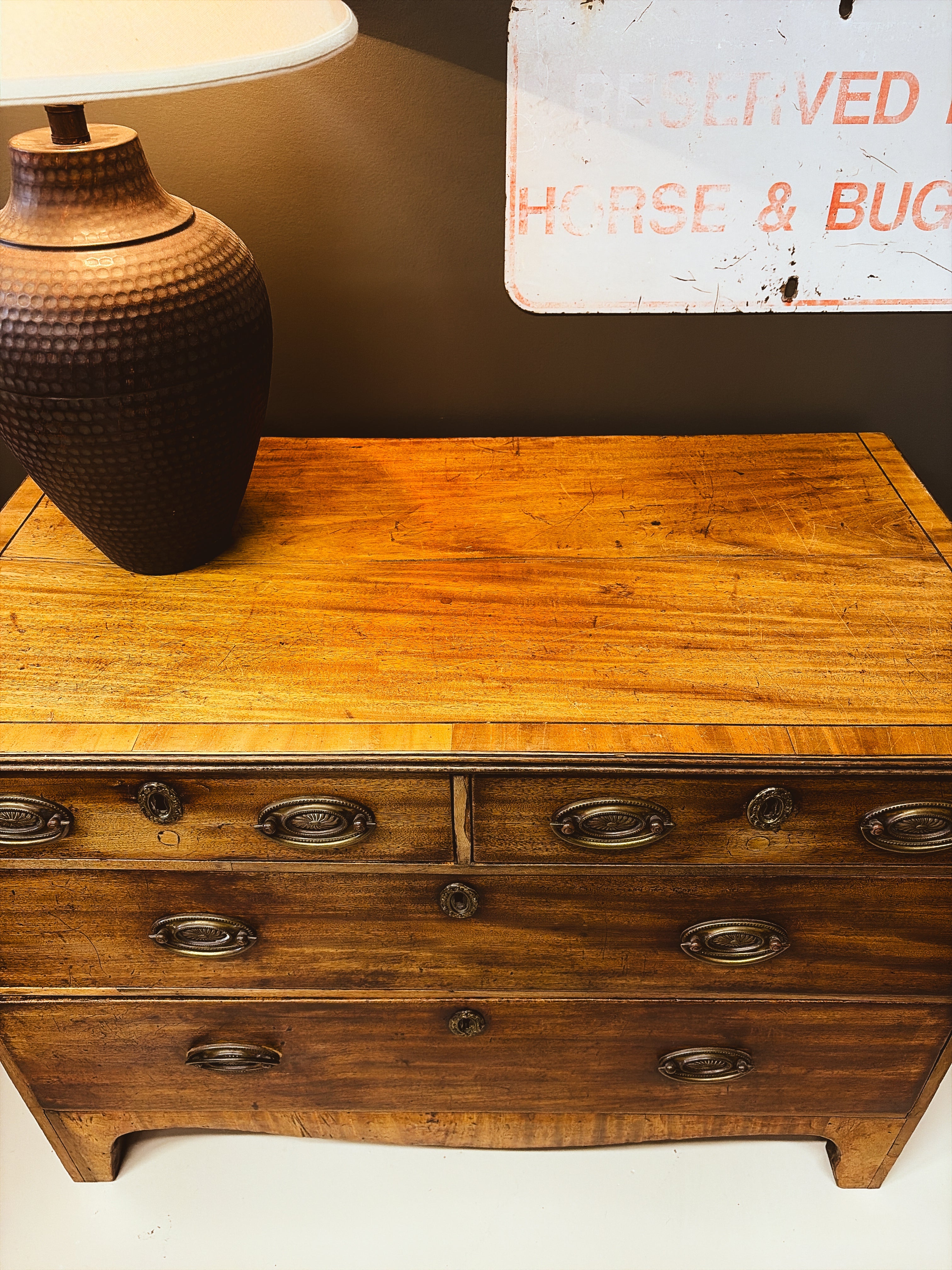 Walnut chest of drawers — top surface detail showing crossbanding and warm patina