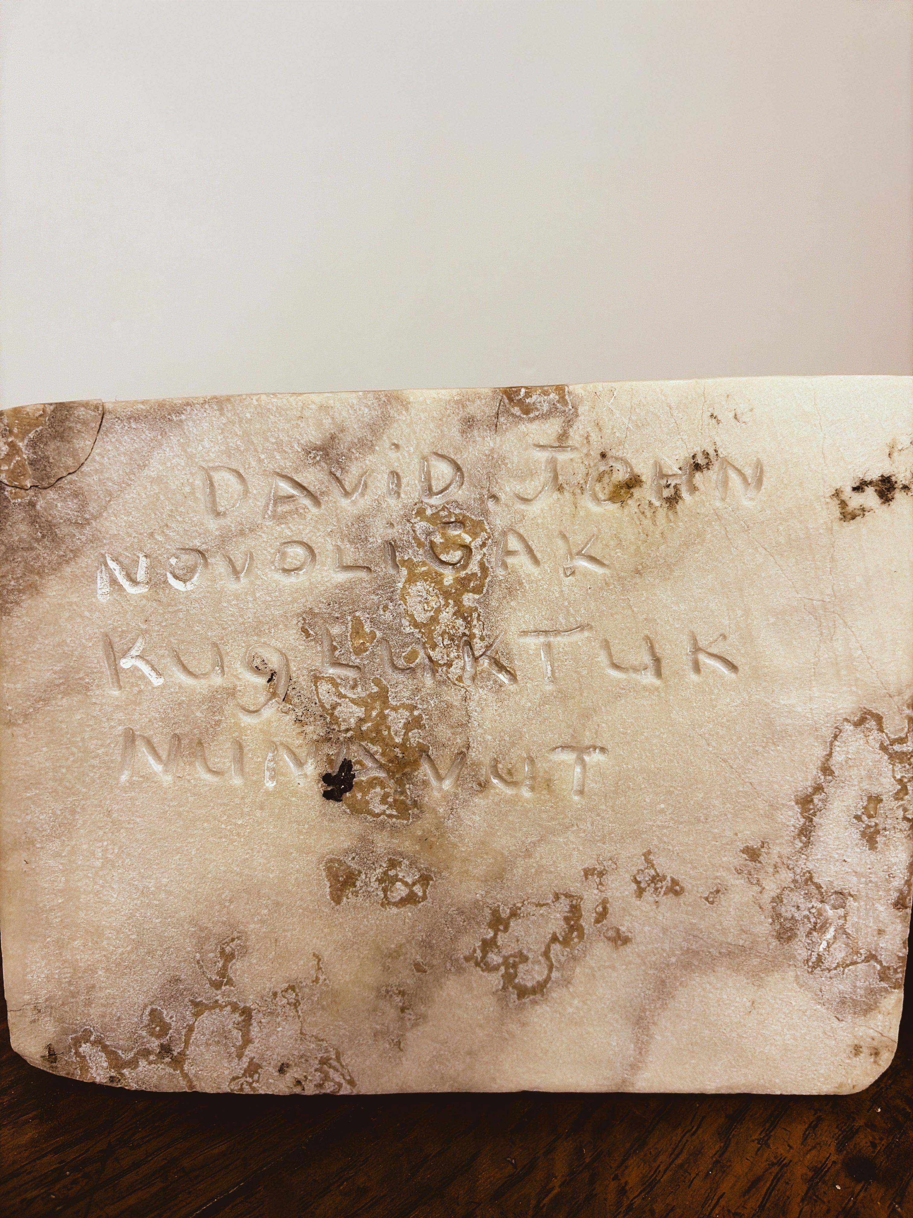 Base of Inuit polar bear sculpture inscribed: David John Novoligak, Kugluktuk, Nunavut