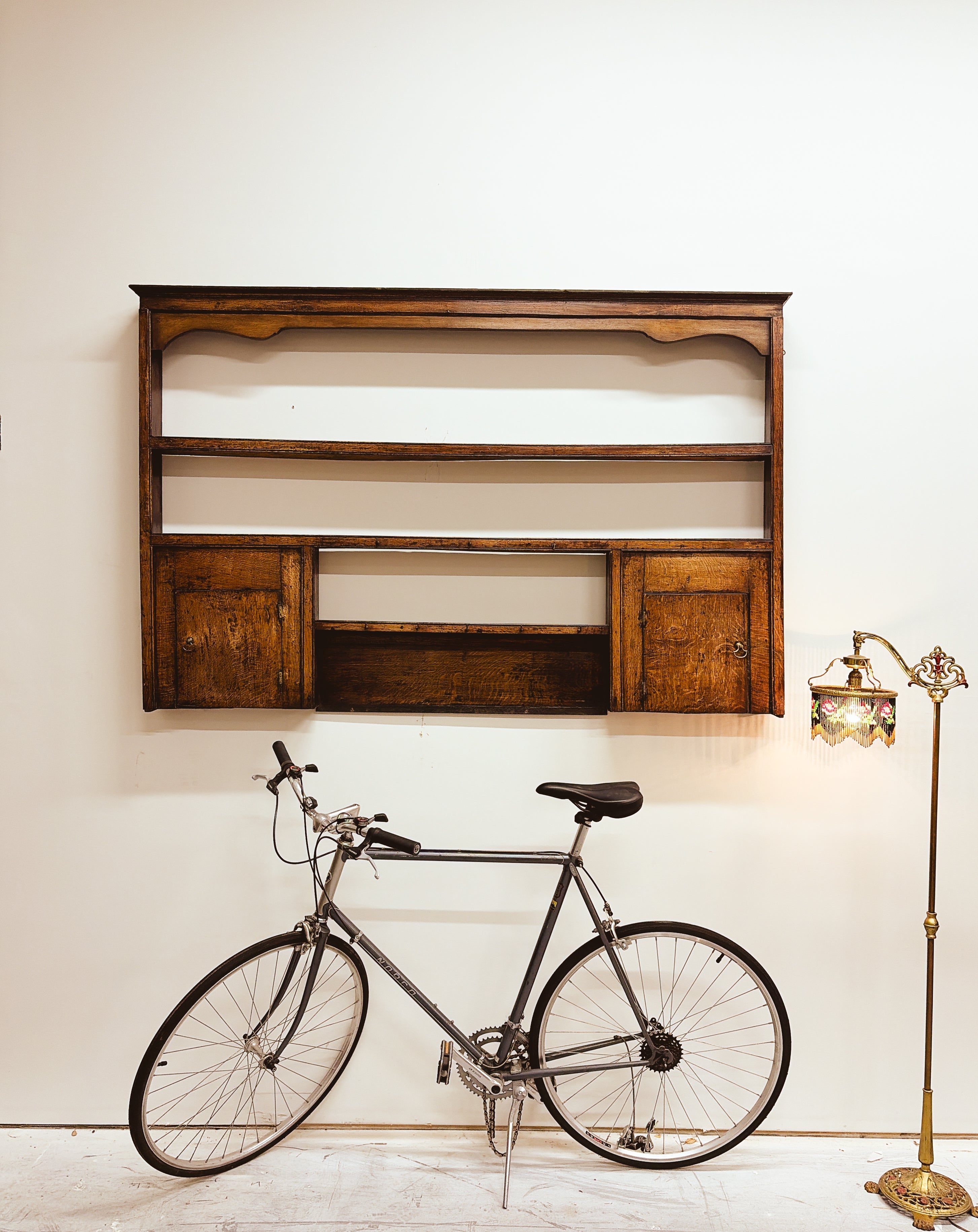 18th century oak Welsh dresser rack hung as a wall shelf — aged honey patina with plate rail and panelled cupboard doors