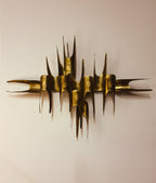 Artist signature detail on brass blade